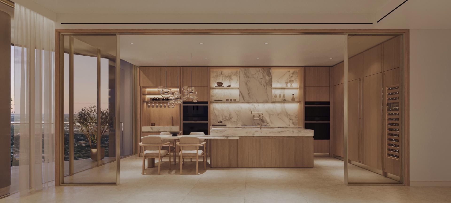 Chef's kitchen with Sub-Zero and Wolf appliances, marble island, and walk-in wine storage